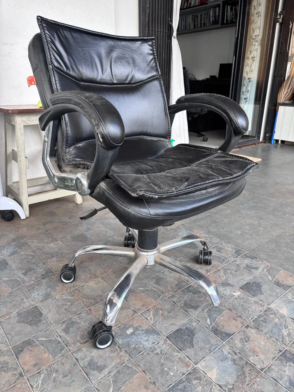 One office chair. One of the leg wheels is broken — Pune