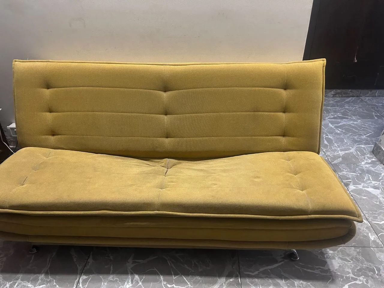 Three seater sofa, has a ripped seam in the middle — Furniture donation in New Delhi